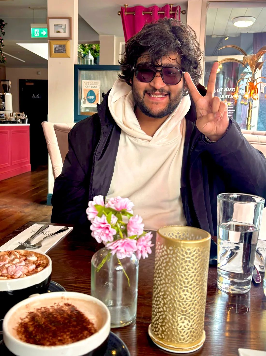 Anirudh Chugh smiling at a café in Ireland